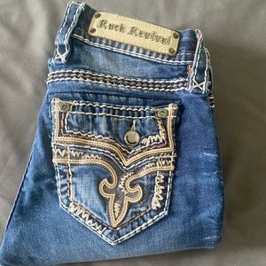 Size 26 studded, medium wash, straight-legged, Buckle jeans.